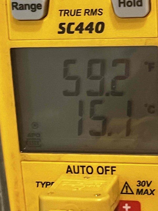 Completed cooling maintenance club visit on air handler unit. Performed diagnostic testing using digital multimeter, recording voltage readings of 59.2V and 15.1V to verify proper electrical operation. Inspected Emerson control board (model 51-3074 REV 1) and confirmed all wire connections at EAC, HUM, LINE, and NEUTRAL terminals were secure. Board displayed EL1 error code on digital readout, which was addressed during service. Verified all electrical connections, wire nuts, and control wiring for proper installation and function. System operating within normal parameters upon completion of maintenance visit.
