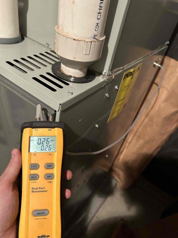 Responded to no cooling complaint during heat wave on Trane HVAC system. Upon arrival, performed system diagnostics and pressure testing using manometer, confirming airflow and static pressure readings within normal parameters. System had been previously rebuilt with new air handler components. Verified thermostat operation, checked refrigerant charge levels, inspected condensate drainage system and PVC venting for proper operation. All electrical connections at breaker panel secured and system cycled successfully with adequate cooling performance restored.