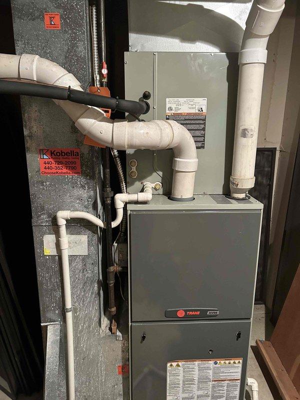 Responded to no cooling complaint during heat wave on Trane HVAC system. Upon arrival, performed system diagnostics and pressure testing using manometer, confirming airflow and static pressure readings within normal parameters. System had been previously rebuilt with new air handler components. Verified thermostat operation, checked refrigerant charge levels, inspected condensate drainage system and PVC venting for proper operation. All electrical connections at breaker panel secured and system cycled successfully with adequate cooling performance restored.