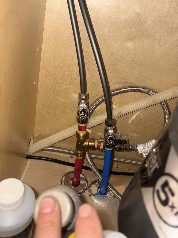 Provided quote for installation of Water Drop GP 600 reverse osmosis system with alternative Water Right RO system comparison for customer consideration. Assessed under-sink plumbing configuration and existing water supply connections to determine installation requirements. Quote includes drilling countertop hole for RO faucet installation and complete system hookup to existing hot and cold water supply lines with brass manifold assembly.