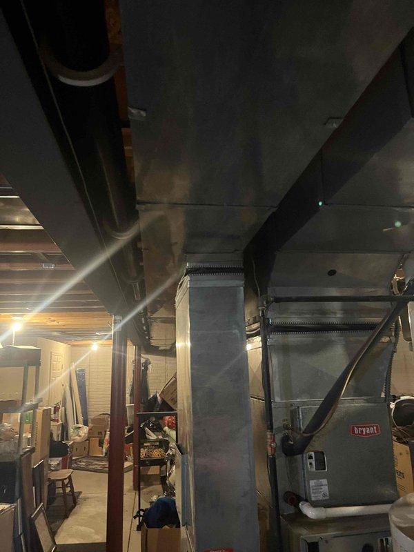 Conducted HVAC replacement estimate for 19-year-old heating and cooling system not performing adequately. Inspected existing Bryant equipment and ductwork in basement mechanical space, documented system configuration and installation conditions. Provided comprehensive replacement options for aged HVAC system.