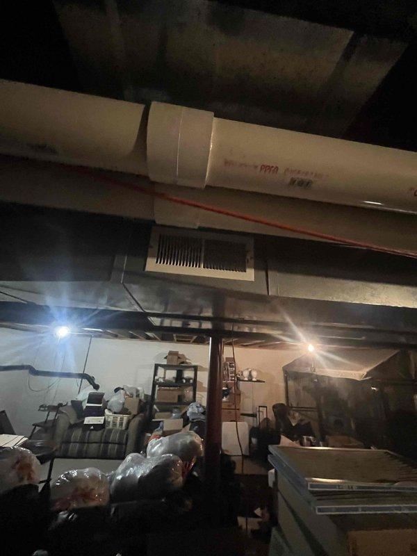 Conducted HVAC replacement estimate for 19-year-old heating and cooling system not performing adequately. Inspected existing Bryant equipment and ductwork in basement mechanical space, documented system configuration and installation conditions. Provided comprehensive replacement options for aged HVAC system.