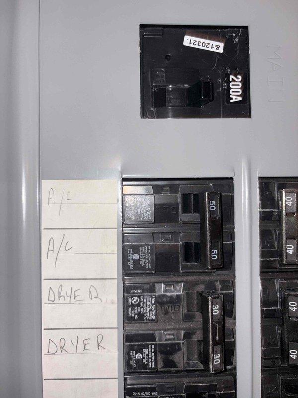 Evaluated residential cooling system for inadequate temperature control in upstairs bedroom while downstairs area maintained proper cooling. Assessed existing electrical panel capacity showing 200A main service with available circuits, and inspected basement utility area for potential mini split installation routing. Provided estimate for ductless mini split heat pump system to address zone-specific cooling deficiency in bedroom area where central air conditioning system fails to deliver adequate airflow.