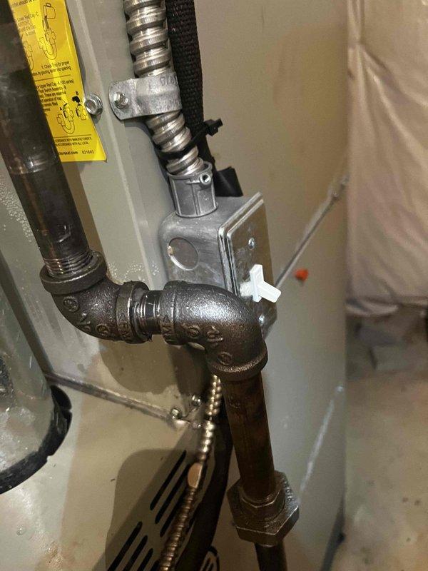 Responded to no cooling complaint on system installed in 2022. Customer reported outdoor fan spinning but no cool air output, suspecting indoor blower malfunction. Upon arrival, inspected both indoor air handler and outdoor condensing unit. Verified outdoor fan motor operation as reported. Examined indoor HVAC equipment in basement mechanical room, including furnace/air handler assembly with associated ductwork and PVC condensate drainage system. Checked electrical connections, control boards, and blower motor operation. Assessed airflow through supply ductwork and verified proper system staging. Diagnosed root cause of cooling failure and restored system to normal operation.