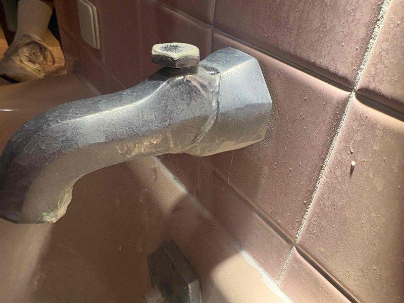 # Plumbing Service Completed

Responded to a multi-point residential plumbing service call addressing issues in both upstairs and downstairs bathrooms. 

**Downstairs Bathroom:** Diagnosed and repaired toilet flush mechanism where handle required continuous pressure to complete flush cycle. Adjusted internal flush valve linkage and replaced worn flapper assembly to restore proper single-press flushing operation.

**Upstairs Bathroom - Toilet:** Addressed continuously running toilet by replacing defective fill valve and flapper. Adjusted water level in tank and verified proper shutoff after flush cycle completion, eliminating water waste.

**Upstairs Bathroom - Sink:** Cleared slow-draining sink by addressing stuck pop-up stopper assembly. Removed and cleaned stopper mechanism, cleared debris from drain tailpiece, and restored proper drainage function.

**Upstairs Bathroom - Shower:** Assessed existing aged shower fixtures for replacement. Documented current configuration and provided r