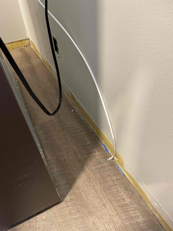 Installed refrigerator line valve to supply water connection for appliance. Valve was properly secured and tested for leaks to ensure reliable water flow to the refrigerator ice maker and water dispenser system.