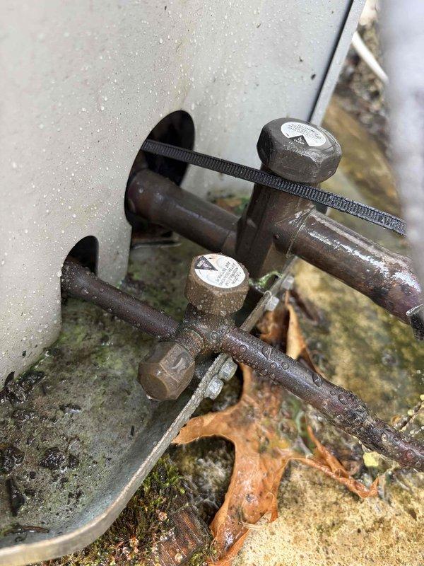 Completed routine cooling maintenance on air handler unit. Member declined relocation of equipment during service. Inspected ventilation grille and exterior mounting hardware, documenting current condition of components showing weathering and oxidation on outdoor fixtures.