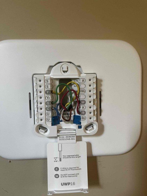 Responded to callback for White-Rodgers thermostat continuously displaying "initializing" screen and failing to call for cooling, resulting in upper level temperature exceeding 80°F. Upon arrival, removed thermostat cover plate and inspected wiring connections at terminal block. Verified all wire terminations including R, Y1, G, C, and remaining terminals were secure and properly seated. Cycled power to thermostat and air handler to clear initialization error. Tested system operation through complete cooling cycle, confirmed proper communication between thermostat and air handler, and verified temperature setpoint response. System now operating normally with cooling functioning as designed.