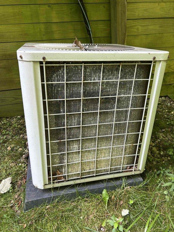 Completed routine cooling maintenance inspection and system evaluation. Upon arrival, documented current condition of outdoor condensing unit, which showed significant accumulation of debris, dust, and grime on condenser coils and protective grille. Unit exhibited signs of extended service without recent maintenance, including weathered cabinet surfaces and organic debris on fan grille. Inspected electrical disconnect boxes mounted on exterior wall, noting rust staining and corrosion on main service disconnect. Performed standard maintenance procedures including coil cleaning, system operational checks, and documentation of equipment condition for ongoing maintenance program enrollment.