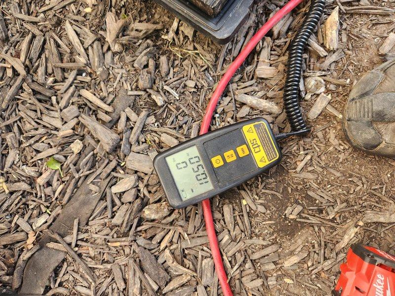 Completed mini split system installation with refrigerant line connections and electrical verification. Installed indoor and outdoor units, ran insulated copper line set through attic space, made flare connections at service ports, and performed voltage testing to confirm proper electrical supply at 25V. System tested and operational upon completion.