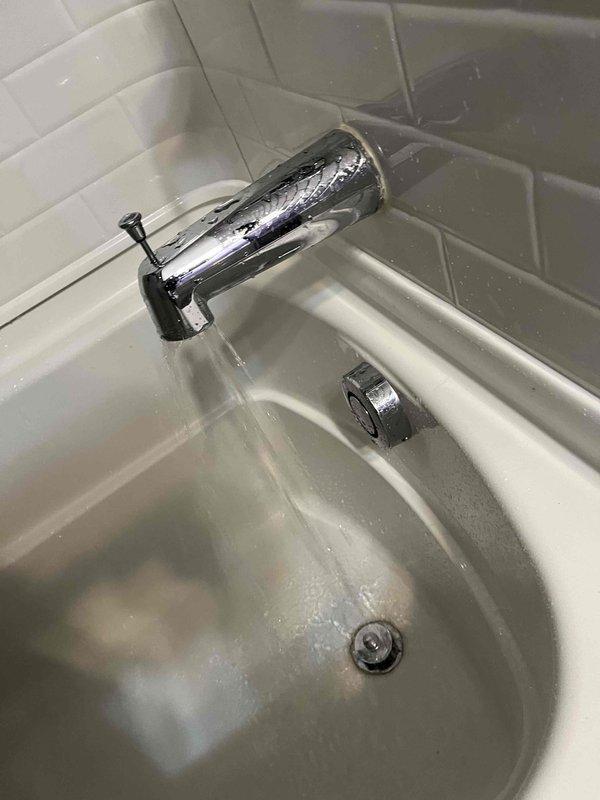 Completed plumbing membership visit and performed comprehensive inspection of bathroom fixtures. Tested faucet operation and water flow at bathroom sink, verified proper drainage function, and inspected under-toilet plumbing components including supply line connections, PVC piping, and check valve assembly to ensure all systems were functioning properly with no leaks detected.