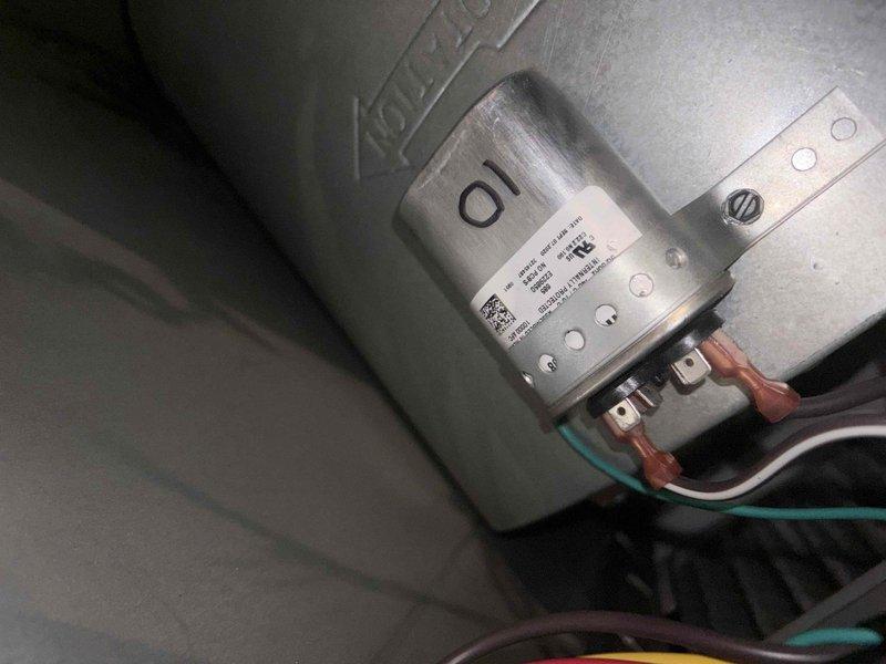 Responded to no cooling call on residential air conditioning system. Upon arrival, diagnosed failed dual run capacitor preventing compressor and condenser fan motor operation. Replaced defective capacitor with proper rated replacement, verified all electrical connections secure, and tested system operation. Unit restored to normal cooling operation with proper amperage readings confirmed using multimeter.