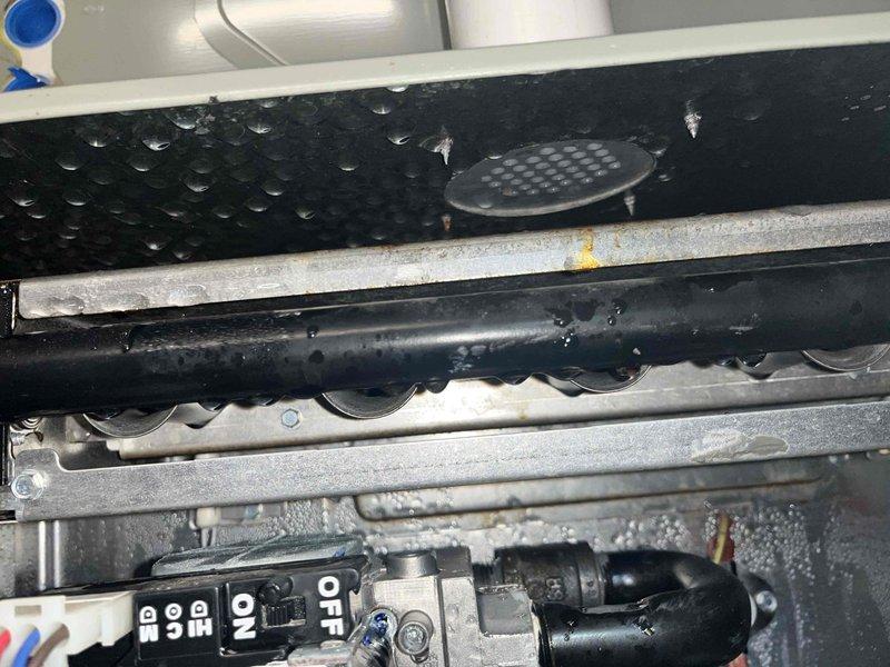 # HVAC Service Completed

Responded to a whole-home air conditioning outage on a 4-year-old AC system. Upon inspection, discovered significant condensate drainage issues with visible water accumulation throughout the equipment compartment. The condensate drain line showed excessive moisture buildup with water droplets hanging from piping, and standing water was present on the drain pan surface. 

Cleared the blocked condensate drain line to restore proper drainage flow. Verified all blower motors and electrical connections were intact and functioning properly despite moisture exposure. Inspected the heat exchanger assembly, control module, and wiring harnesses for any water damage or compromised connections. Tested system operation and confirmed cooling functionality was restored. All components returned to normal operating condition with proper condensate drainage re-established.