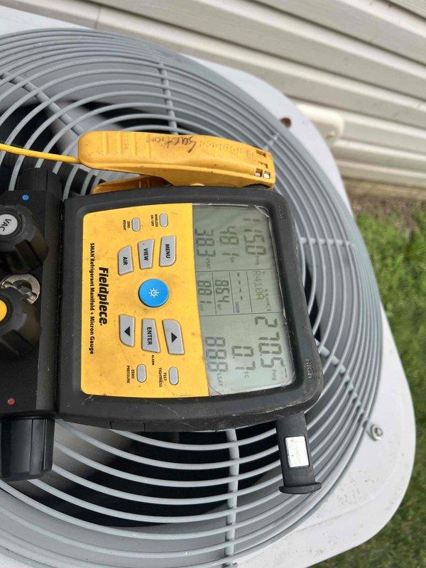 Responded to emergency no-cool call on thirteen-year-old air conditioning system. Performed diagnostic testing using digital meters to assess system performance, measuring electrical parameters at the outdoor condenser unit and verifying supply air temperature at 69°F. Identified system malfunction preventing proper cooling operation and documented equipment conditions with diagnostic readings for customer records.