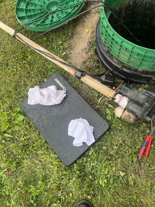 Responded to service call for beeping sump pump system originally installed in 2023. Upon arrival, removed basin cover and inspected pump assembly and float mechanism within the corrugated sump basin. Identified alarm condition indicating potential float switch malfunction or low battery in backup system. Verified pump operation, checked discharge piping connections, and tested float activation sequence. Cleaned debris from basin, reset alarm system, and confirmed proper pump cycling and automatic shutoff functionality before reassembling cover and restoring system to normal operation.