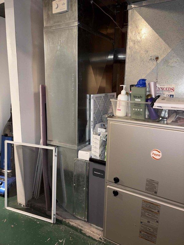 Conducted replacement estimate for 29-year-old Carrier air conditioning system that is no longer operational, affecting cooling throughout entire home. Assessed existing indoor Payne furnace with air handler and outdoor Carrier condensing unit, documented current equipment configuration and condition, and provided comprehensive replacement options for complete system upgrade.