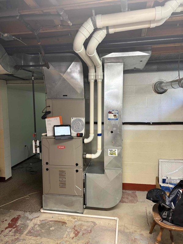 Responded to service call for non-operational air conditioning system in residential property. Customer reported previous contractor quoted expensive blower motor replacement and requested pricing for complete system replacement. Evaluated existing Bryant furnace and air handler installation in basement mechanical room, assessed current equipment condition and ductwork configuration including white PVC supply ducts extending from furnace unit. Provided comprehensive estimate for new HVAC system replacement including equipment specifications and installation requirements based on existing infrastructure and customer needs.