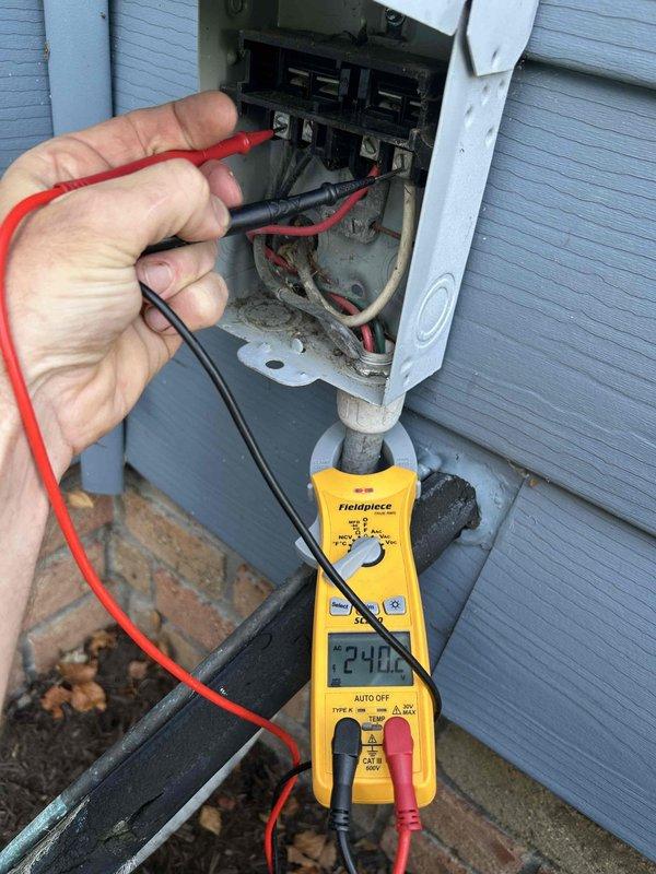 Responded to no cooling complaint in in-law suite. Upon arrival, performed electrical diagnostics on outdoor condensing unit. Verified incoming line voltage at disconnect box reading 240V, confirming proper power supply to equipment. Measured compressor amperage at 432 amps using clamp meter to assess unit operation and electrical draw. System evaluation completed with electrical testing of all major components to determine cause of cooling failure.