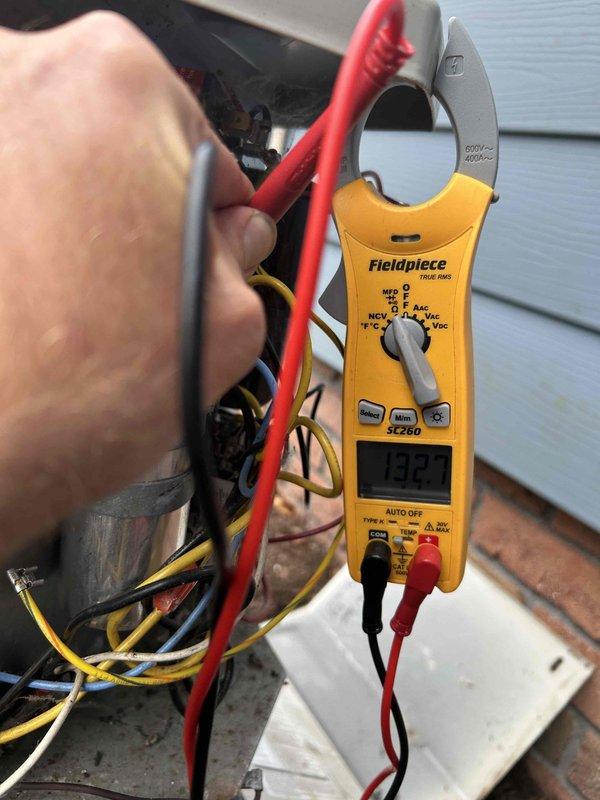 Responded to no cooling complaint in in-law suite. Upon arrival, performed electrical diagnostics on outdoor condensing unit. Verified incoming line voltage at disconnect box reading 240V, confirming proper power supply to equipment. Measured compressor amperage at 432 amps using clamp meter to assess unit operation and electrical draw. System evaluation completed with electrical testing of all major components to determine cause of cooling failure.