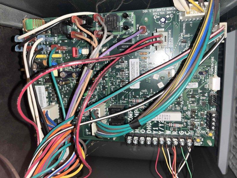 Responded to service call for odor complaint from upstairs attic-mounted air conditioning system. Inspected control board assembly and measured supply air temperature at 81.5°F, indicating system operation. Examined circuit boards, wiring connections, and ductwork for signs of overheating, burning components, or moisture intrusion that could cause odors.