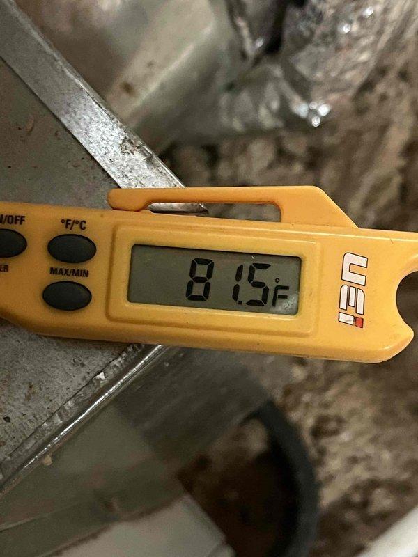 Responded to service call for odor complaint from upstairs attic-mounted air conditioning system. Inspected control board assembly and measured supply air temperature at 81.5°F, indicating system operation. Examined circuit boards, wiring connections, and ductwork for signs of overheating, burning components, or moisture intrusion that could cause odors.