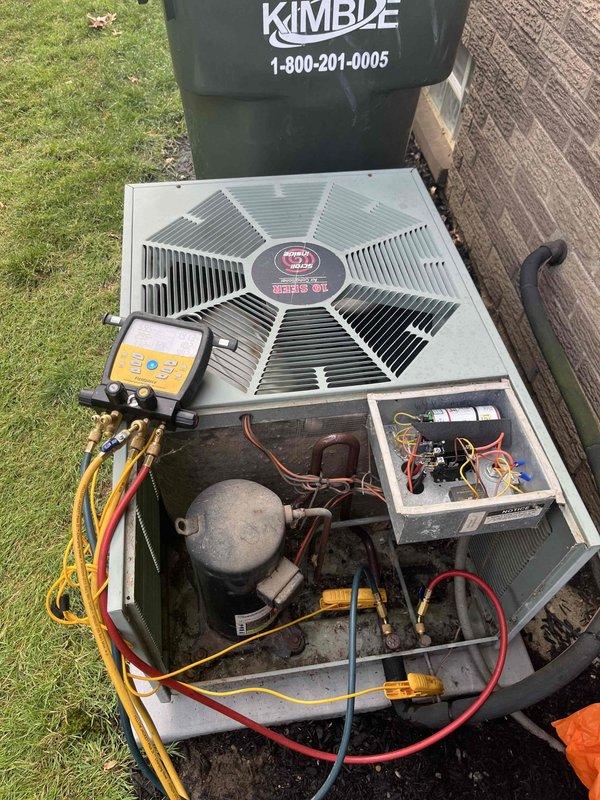 Completed cooling maintenance club member visit on outdoor condensing unit. Removed access panel and performed system diagnostics using digital manifold gauges to verify refrigerant pressures and system performance. Measured supply air temperature at 59.9°F using infrared thermometer, confirming proper cooling operation. Inspected compressor, refrigerant lines, electrical connections, and capacitor. System operating within normal parameters with no immediate repairs required.