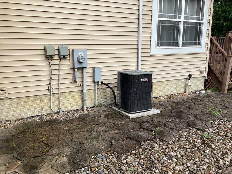 Conducted comprehensive assessment of 19-year-old split HVAC system requiring full replacement. Evaluated existing Lennox furnace unit located in basement and outdoor air conditioning condensing unit mounted on concrete pad adjacent to residence. Both components have reached end of expected service life and require replacement to ensure continued reliable heating and cooling performance.
