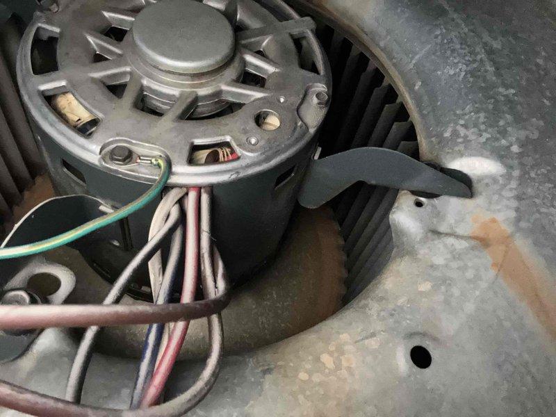 Responded to service call for grinding noise from blower motor while system continued to operate. Upon inspection, identified worn motor bearings causing the abnormal sound in the air handler unit. Lubricated motor bearings and verified proper motor operation, eliminating the grinding noise while maintaining normal cooling function.