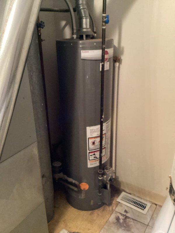 Conducted comprehensive site assessment of existing HVAC system at condominium unit built on slab foundation. Primary concern addressed was dust and debris discharge from supply registers, attributed to in-ground ductwork installation common in slab construction. Performed visual inspection of rooftop condenser unit and interior mechanical equipment. Documented existing water heater and HVAC equipment configuration in utility closet, noting plumbing connections and spatial constraints for potential equipment replacement. Captured photographic documentation of rooftop condenser condition and interior equipment layout to support replacement estimate preparation. Identified challenges associated with underground duct system that may require additional scope evaluation including possible duct camera inspection to assess interior duct condition and contamination levels.