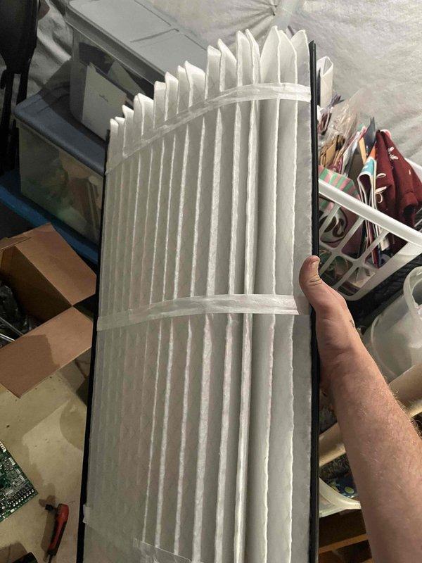 Completed return service call for previously sold blower motor replacement. Verified material was on-site and performed system temperature diagnostics using digital thermometer, recording 74.4°F at unit location. Inspected air filter condition, which showed clean pleated media with no replacement needed at this time.