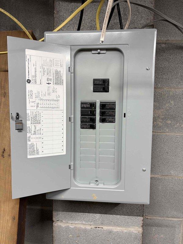 Conducted on-site assessment for mini split installation in unfinished basement utility area. Evaluated existing electrical panel capacity and available breaker spaces to accommodate new mini split system requirements. Documented workspace layout, ceiling joist configuration, and potential mounting locations for indoor air handling unit. Provided comprehensive quote for mini split system installation including electrical connections and equipment placement recommendations.