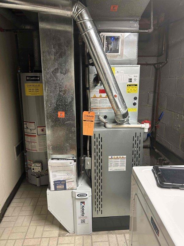 Responded to customer report of water dripping sound from HVAC system. Converted scheduled cooling maintenance visit to service call to address ongoing water issue. Inspected R22/R410A refrigerant evaporator coil and condensate drainage system in basement mechanical room. Documented equipment conditions including furnace, air handler, and associated ductwork. System was shut off by customer prior to arrival due to persistent dripping concern, requiring diagnostic evaluation of condensate trap and drain line configuration per manufacturer specifications.