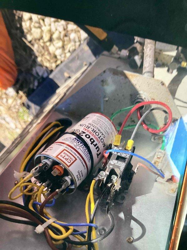 Responded to no cooling call on 10+ year old HVAC system. Upon inspection, diagnosed failed dual run capacitor causing compressor and condenser fan motor failure to operate. Replaced defective capacitor with proper rated replacement, verified all electrical connections secure, and tested system operation. Unit restored to normal cooling operation with proper amperage draws on both compressor and fan motor circuits.