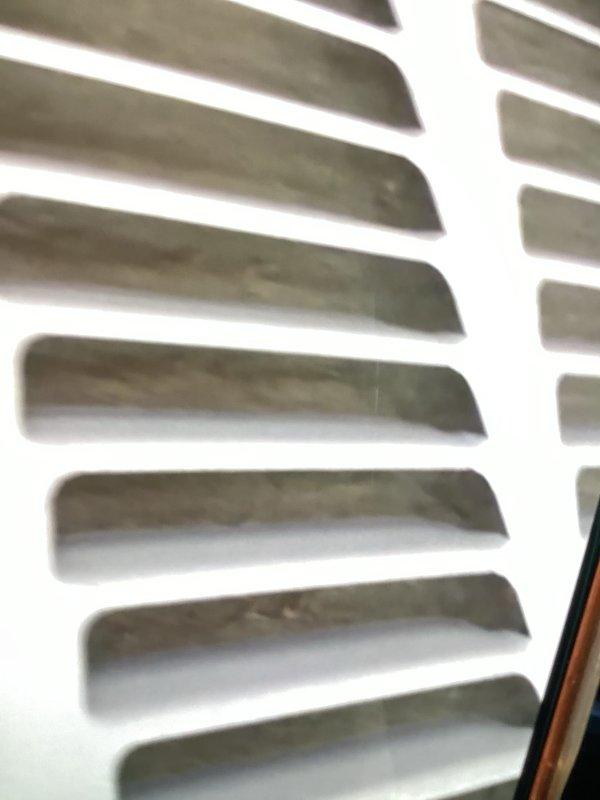 Responded to no cooling complaint with unit blowing warm air. Upon arrival, inspected air handler and return air grilles, which showed dust accumulation and restricted airflow. Documented condition of ventilation components and advised on system status per diagnostic protocol.