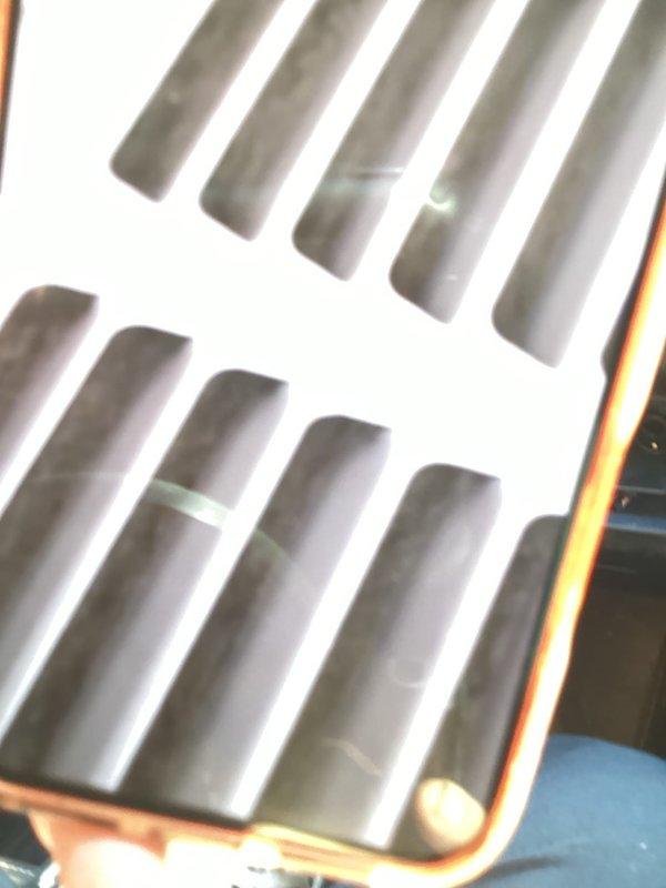 Responded to no cooling complaint with unit blowing warm air. Upon arrival, inspected air handler and return air grilles, which showed dust accumulation and restricted airflow. Documented condition of ventilation components and advised on system status per diagnostic protocol.