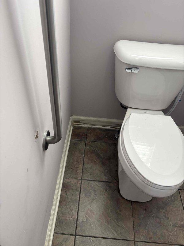 Responded to service call for toilet requiring internal component replacement in fourteen-year-old residential property. Upon arrival, accessed bathroom and performed diagnostic assessment of malfunctioning toilet fixture. Removed toilet tank lid and inspected internal flush mechanism, fill valve, flapper assembly, and overflow tube for wear and operational deficiencies. 

Shut off water supply at angle stop valve and drained tank completely. Disconnected existing braided stainless steel supply line from tank inlet. Removed deteriorated fill valve assembly by loosening locknut and lifting unit from tank opening. Extracted worn flapper from flush valve seat and disconnected chain from flush lever. Inspected flush valve for cracks or damage requiring seal replacement.

Installed new fill valve assembly, ensuring proper height adjustment and secure mounting with locknut tightened hand-tight plus quarter turn. Positioned new flapper onto flush valve seat with proper alignment and connected