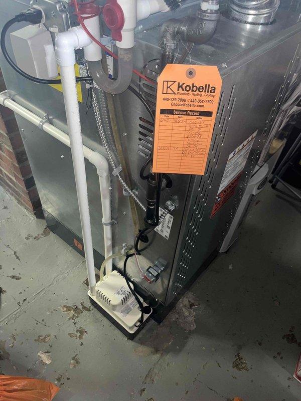 Responded to customer concern regarding abnormal noise and loud "revving" sound from air conditioning system. Performed complete system inspection of HVAC unit installed approximately three years ago. Conducted routine maintenance service on air handler system, including examination of all mechanical components, condensate pump operation, and drainage system functionality. Verified proper system operation, checked refrigerant levels, inspected electrical connections, and ensured all safety controls were functioning correctly. Addressed moisture accumulation concerns evident around condensate pump area and confirmed drainage system is operating as designed.