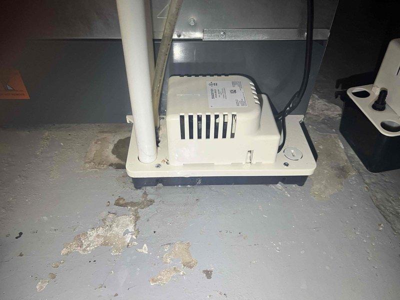 Responded to customer concern regarding abnormal noise and loud "revving" sound from air conditioning system. Performed complete system inspection of HVAC unit installed approximately three years ago. Conducted routine maintenance service on air handler system, including examination of all mechanical components, condensate pump operation, and drainage system functionality. Verified proper system operation, checked refrigerant levels, inspected electrical connections, and ensured all safety controls were functioning correctly. Addressed moisture accumulation concerns evident around condensate pump area and confirmed drainage system is operating as designed.