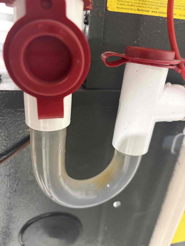 Responded to no cooling call on 2-year-old residential air conditioning system affecting entire home. Upon arrival, performed system diagnostics and inspection of both indoor and outdoor equipment. Inspected air handler in attic space, verifying proper filter installation and airflow. NAFCO pleated filter found properly seated in housing with adequate airflow passage. Examined condensate drainage system including primary drain line, P-trap assembly, and safety switch components. Clear condensate trap confirmed operational and free of blockages, with Rectorseal safety switch properly installed and functioning. All PVC drain piping connections verified secure with no signs of leakage or obstruction. Checked indoor unit operation, electrical connections, and safety controls. System restored to normal cooling operation with whole-house comfort achieved.