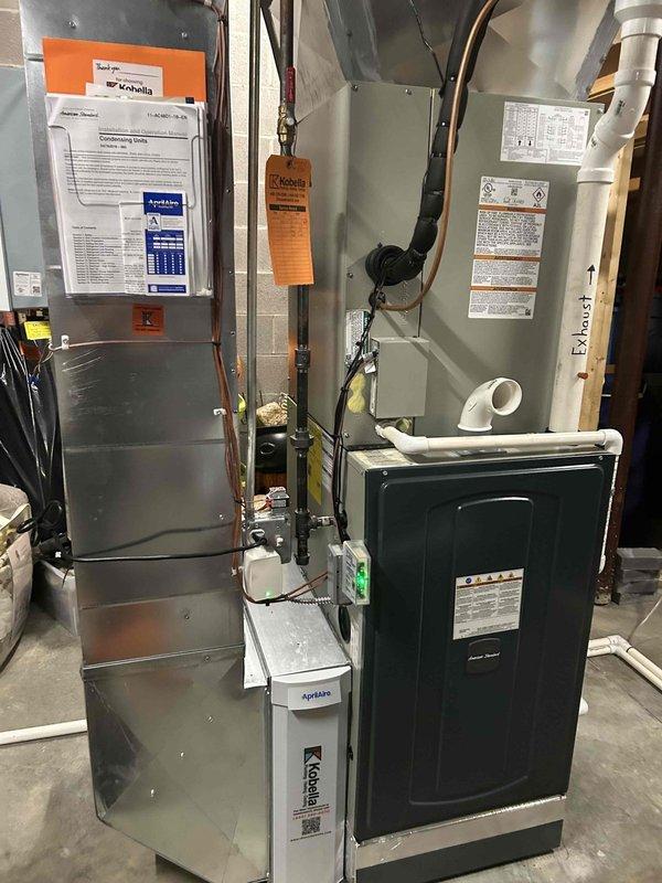 Responded to no cooling complaint on upstairs zone of 1-year-old system. Performed diagnostic testing using digital manometer, measuring static pressures of 0.45 and 0.43 inches water column across the air handler and ductwork system. Inspected recently installed HVAC equipment including air handler, AprilAire indoor air quality system, and associated ductwork connections to identify cause of cooling failure and restore proper system operation.