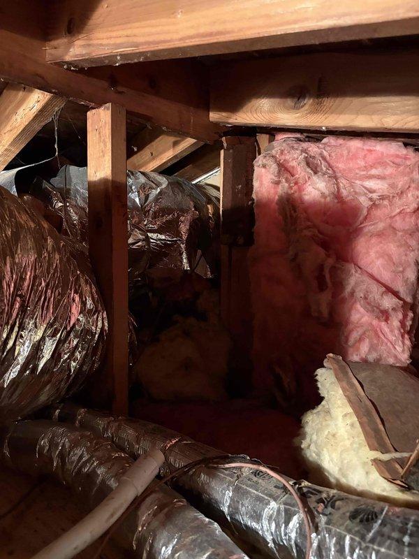 Responded to service call for air conditioning system running constantly with suspected low refrigerant levels. Accessed attic space to evaluate existing HVAC system and ductwork configuration. After assessment, provided comprehensive estimate for complete air conditioning system replacement, including new air handler unit to address aging R22 refrigerant system and continuous runtime issues.