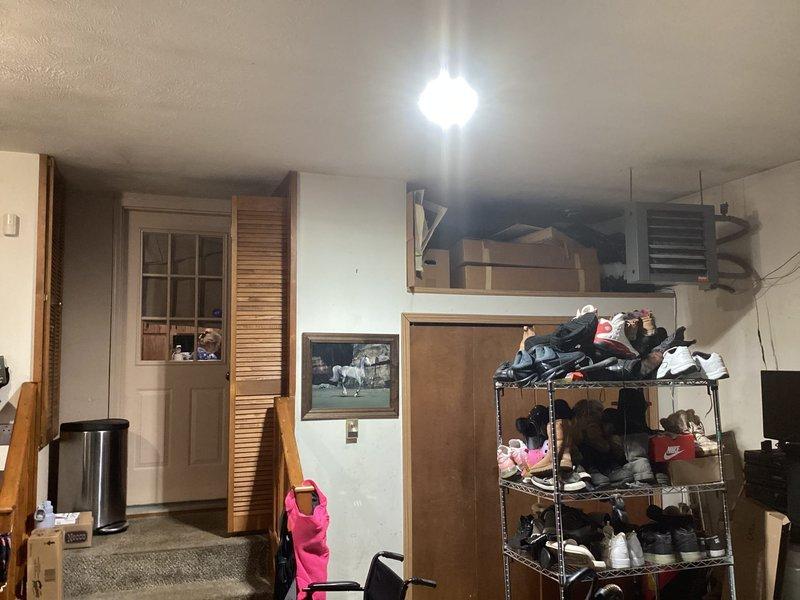 Conducted on-site evaluation for complete HVAC system replacement and ductwork extension to kitchen area. Assessed existing air conditioning unit of unknown age, examined current duct configuration in utility/basement area, and documented access points including louvered closet door housing HVAC equipment. Provided customer with replacement options and discussed routing requirements for new supply duct to adequately condition previously unserved kitchen space.