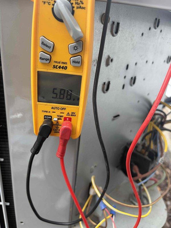 Responded to no cooling call on 10+ year old system. Upon arrival, confirmed outdoor fan motor was not operating. Performed electrical diagnostics using digital multimeter to test voltage and continuity at fan motor and capacitor connections. Measured incoming voltage at contactor and traced power supply through control circuit. Identified failed fan motor as root cause of no cooling condition. Advised customer of findings and provided repair options. Unit unable to operate until fan motor replacement completed.