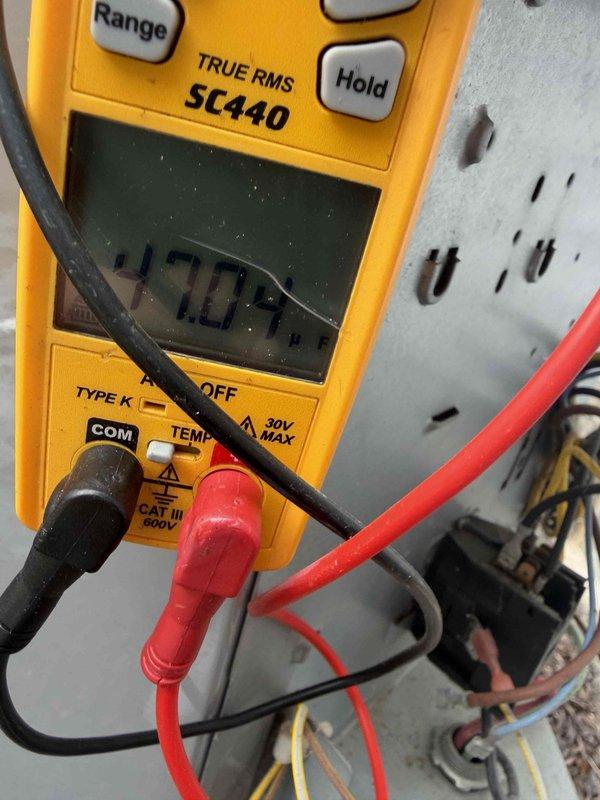 Responded to no cooling call on 10+ year old system. Upon arrival, confirmed outdoor fan motor was not operating. Performed electrical diagnostics using digital multimeter to test voltage and continuity at fan motor and capacitor connections. Measured incoming voltage at contactor and traced power supply through control circuit. Identified failed fan motor as root cause of no cooling condition. Advised customer of findings and provided repair options. Unit unable to operate until fan motor replacement completed.