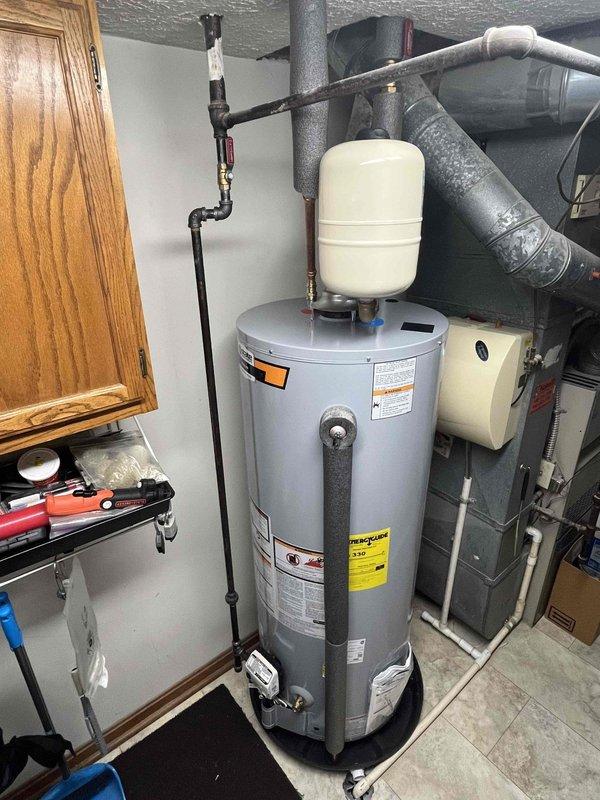 Responded to emergency water leak on hot water supply line beneath kitchen sink. Upon arrival, confirmed active leak from hot side connection and verified main water supply had been shut off to prevent further water damage. Inspected affected plumbing connections, identified source of leak, and completed necessary repairs to restore proper water service to the residence.