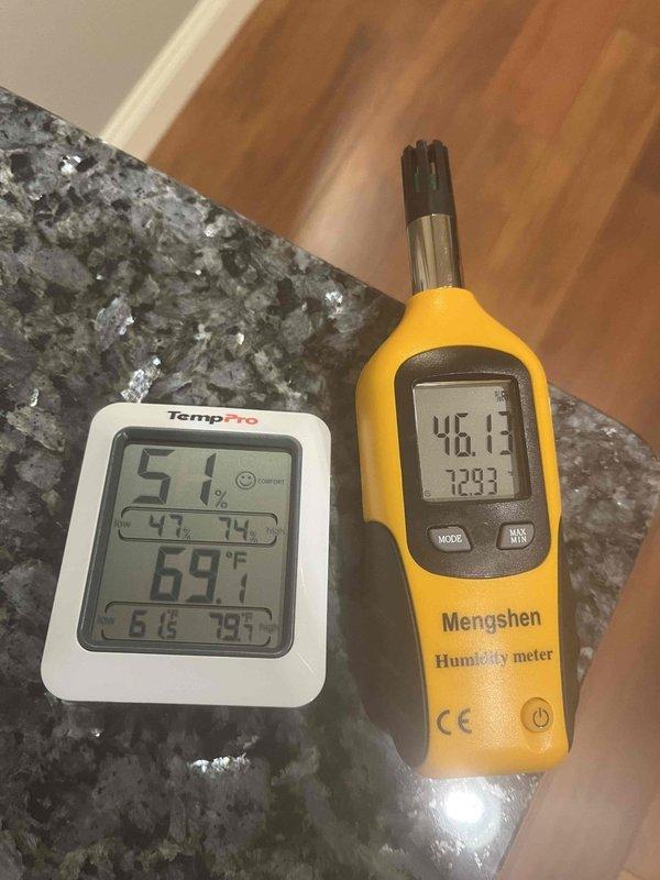Conducted on-site assessment of existing Rheem Performance Platinum water heater for replacement quotation. Inspected current installation including plumbing connections, venting configuration, and proximity to HVAC equipment in basement utility area. Documented ambient conditions using digital measurement devices, recording temperature and humidity levels to assess environmental factors affecting equipment performance and longevity.