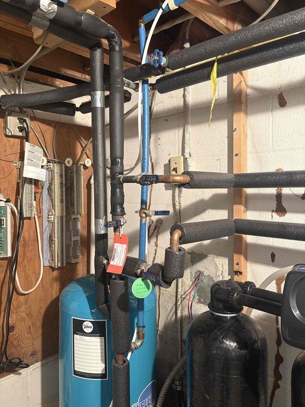 Performed routine maintenance and descaling service on tankless water heater system. Removed existing water softener equipment from utility area to accommodate customer's natural stone flooring installation, with softener system scheduled for reinstallation the following day. Identified and documented multiple deteriorated pipe elbows throughout the plumbing system requiring replacement to prevent future leaks and maintain proper water flow.