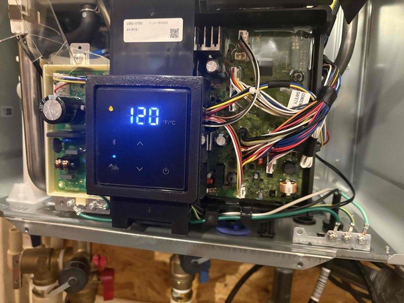 Responded to service call for Rinnai tankless water heater displaying error code 70. Per Rinnai technical support recommendation, performed diagnostic evaluation of control board and electrical components using multimeter to verify suspected board defect. Inspected internal circuit boards, wiring connections, and digital control panel showing 120°F temperature reading. Verified all electrical connections, tested voltage at key components, and documented system configuration including heat exchanger assembly, gas valve connections, and water supply lines. Confirmed findings consistent with control board malfunction requiring replacement.