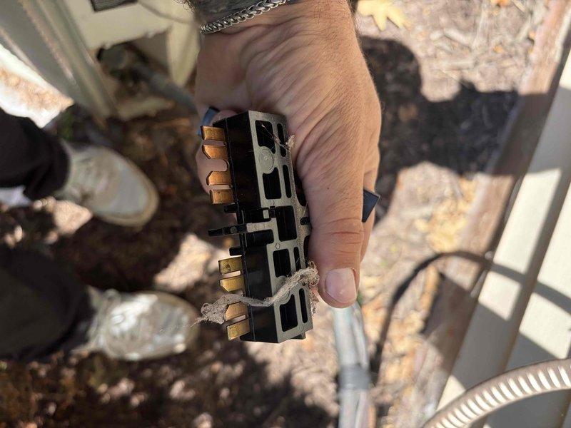Completed comprehensive air conditioning tune-up on an 8-year-old residential cooling system. Performed standard maintenance procedures including inspection of electrical connections at outdoor unit, verified proper wire terminations at terminal block, and confirmed disconnect switch operation. System operating within normal parameters with no deficiencies noted at time of service.