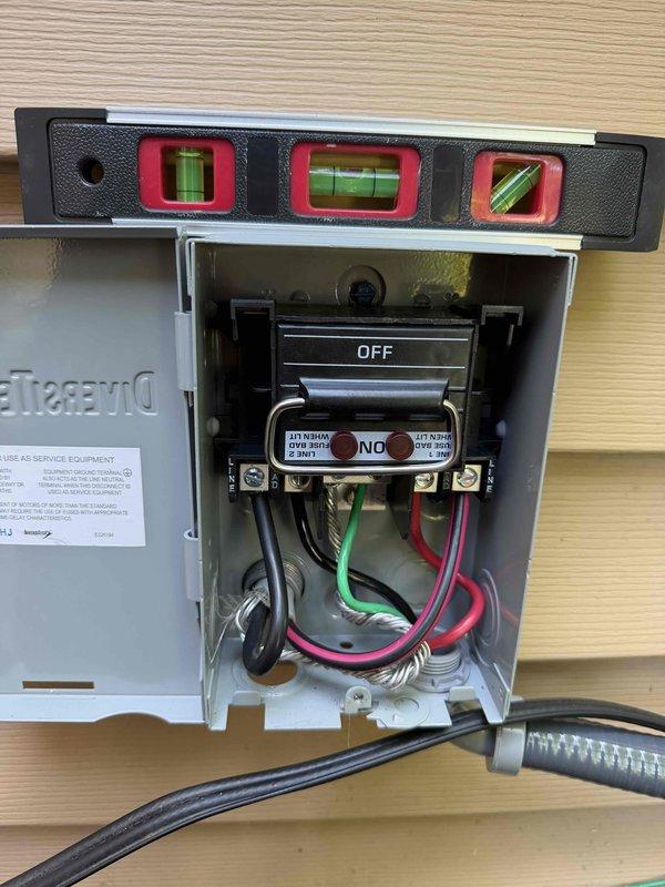 Completed full HVAC system installation including outdoor condensing unit and electrical disconnect box. Verified proper leveling of all equipment using precision level tools, ensuring optimal system performance and longevity. All electrical connections secured to code specifications with proper wire terminations and disconnect switch in accessible location on exterior wall.